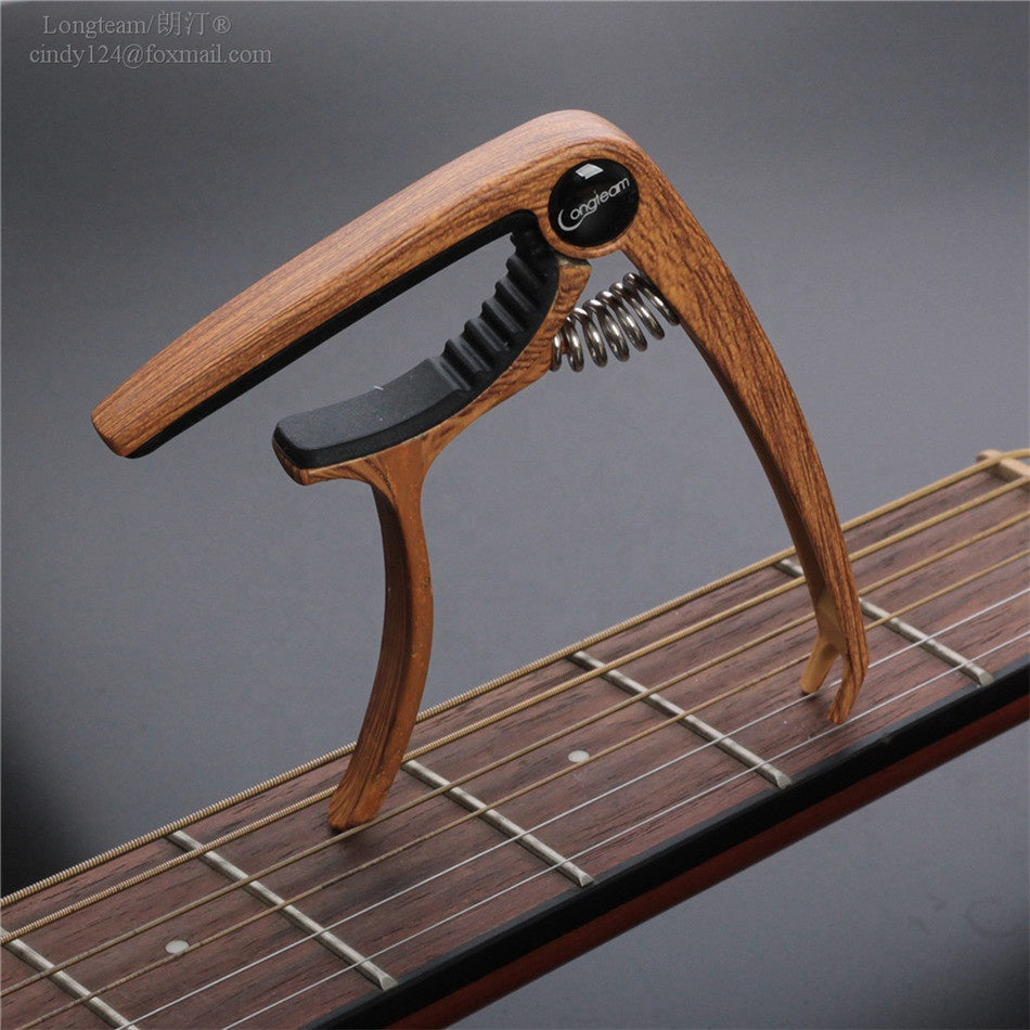 Capo för ukulele/gitarr